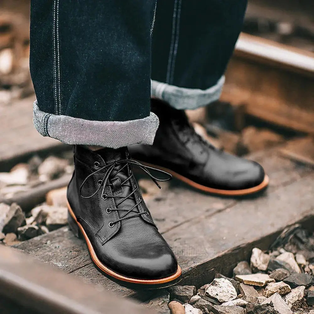 Men’s retro black leather lace-up ankle work boots with tan soles and detailed stitching for durable style