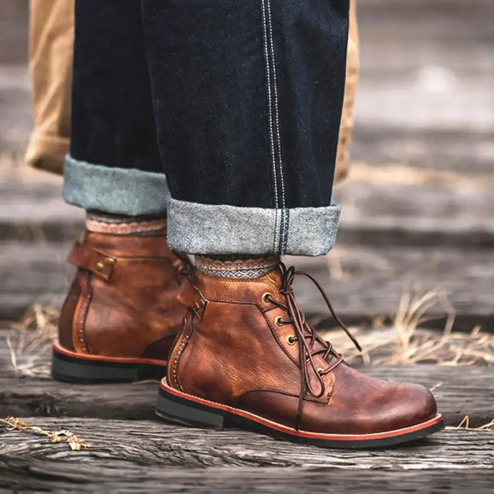 Men’s retro brown leather lace-up ankle boots with rugged well-worn appearance and contrasting black soles