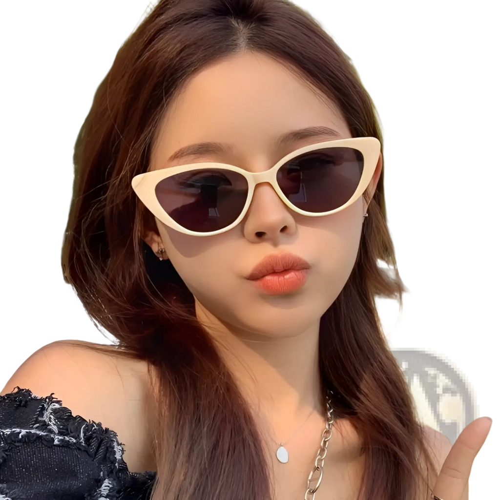 Retro chic cat eye sunglasses in cream color with dark brown tinted lenses for stylish sun protection