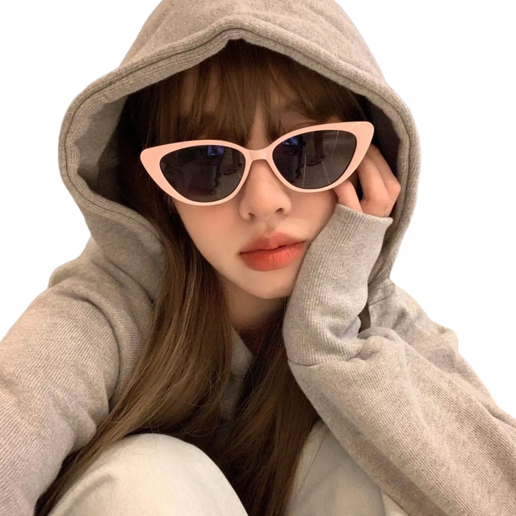 Pink retro chic cat eye sunglasses with tinted dark lenses showcasing stylish eyewear accessory