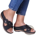 Retro floral leather wedge sandals featuring black floral embellishments, perforated leather straps, and a tan sole