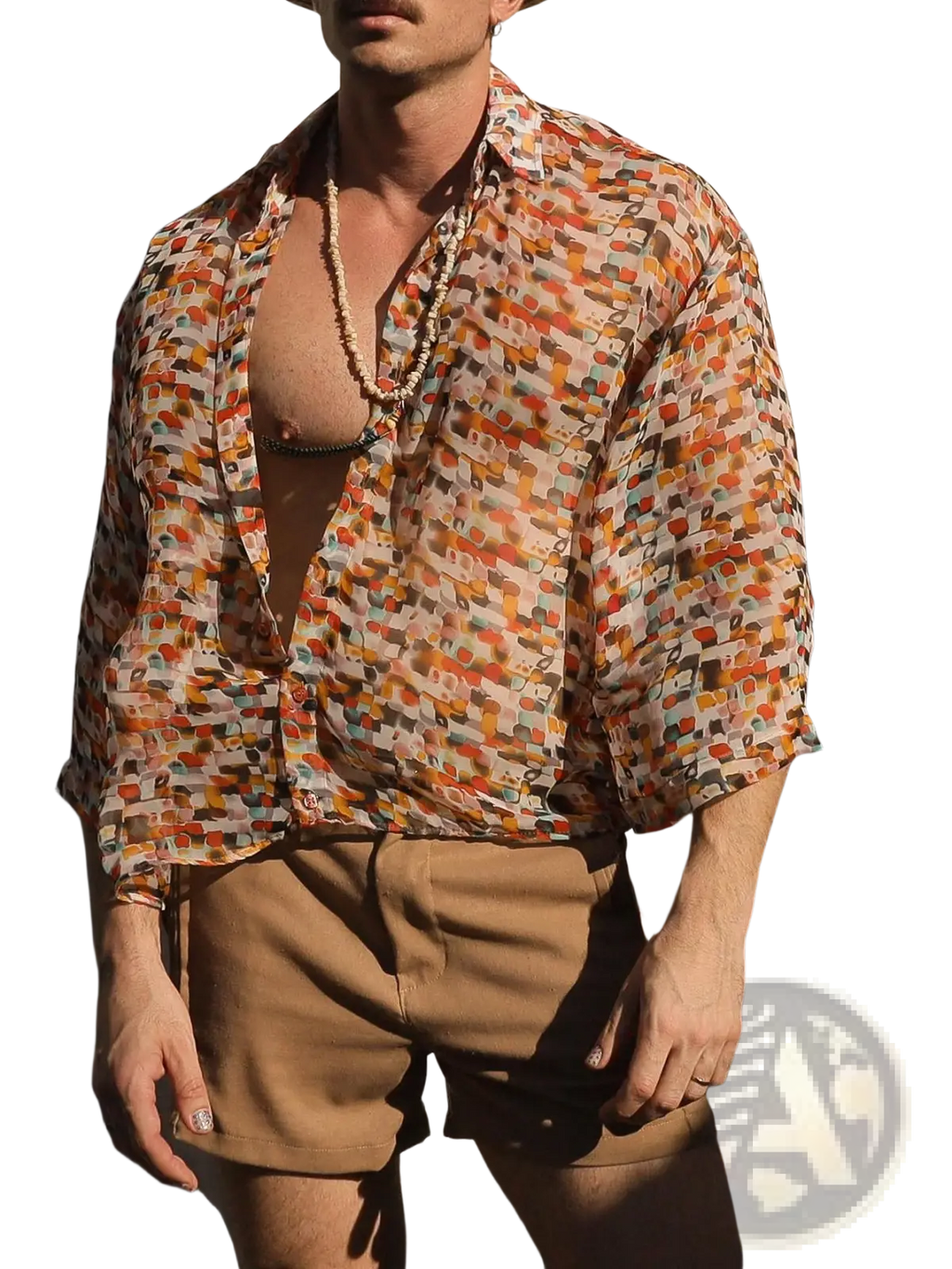 A man wearing a retro geometric sheer oversized vacation shirt with abstract warm tones in orange red and beige