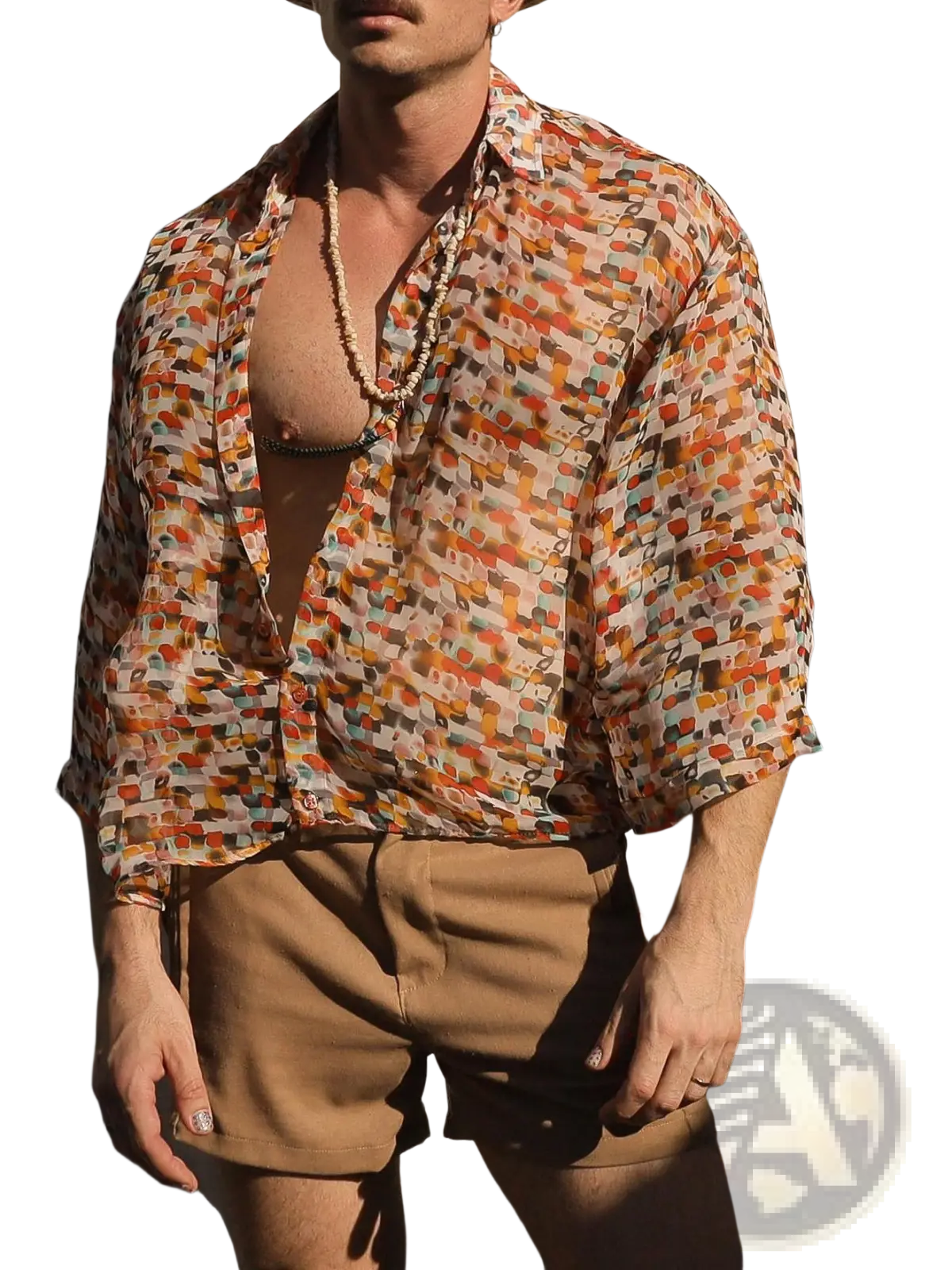 A man wearing a retro geometric sheer oversized vacation shirt with abstract warm tones in orange red and beige
