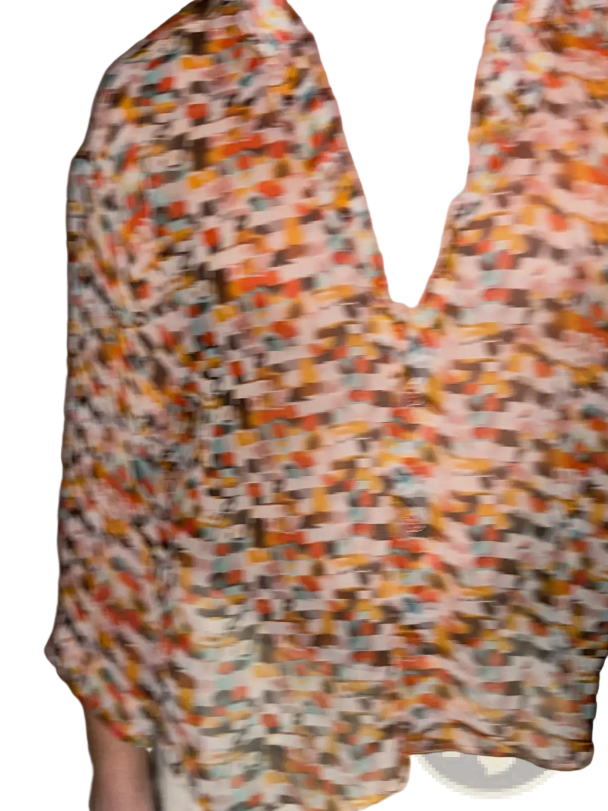 A vibrant retro geometric sheer oversized vacation shirt with short sleeves in orange brown and teal on a light background