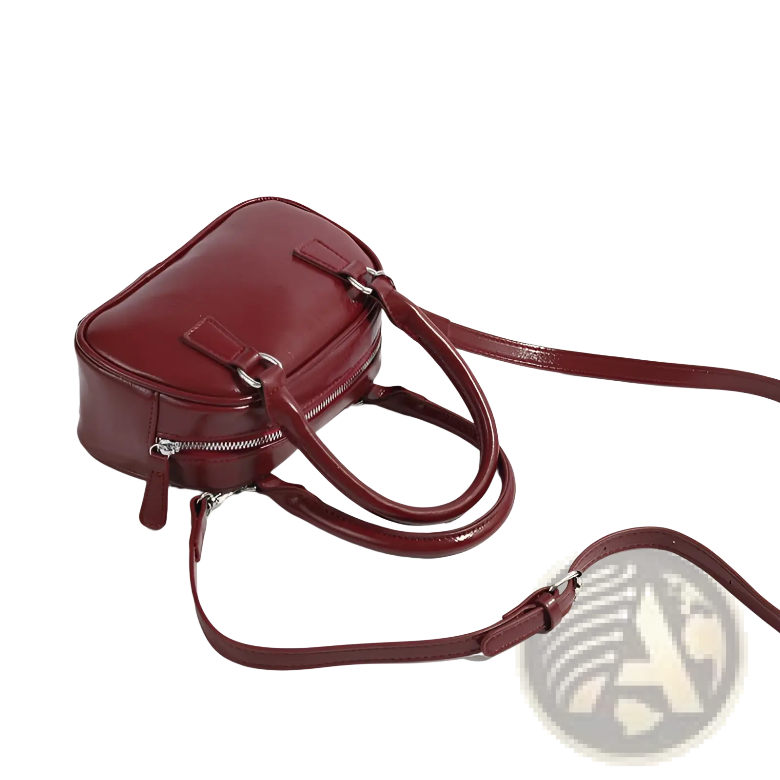 A retro glossy pu leather small square handbag in burgundy with dual top handles and an adjustable shoulder strap
