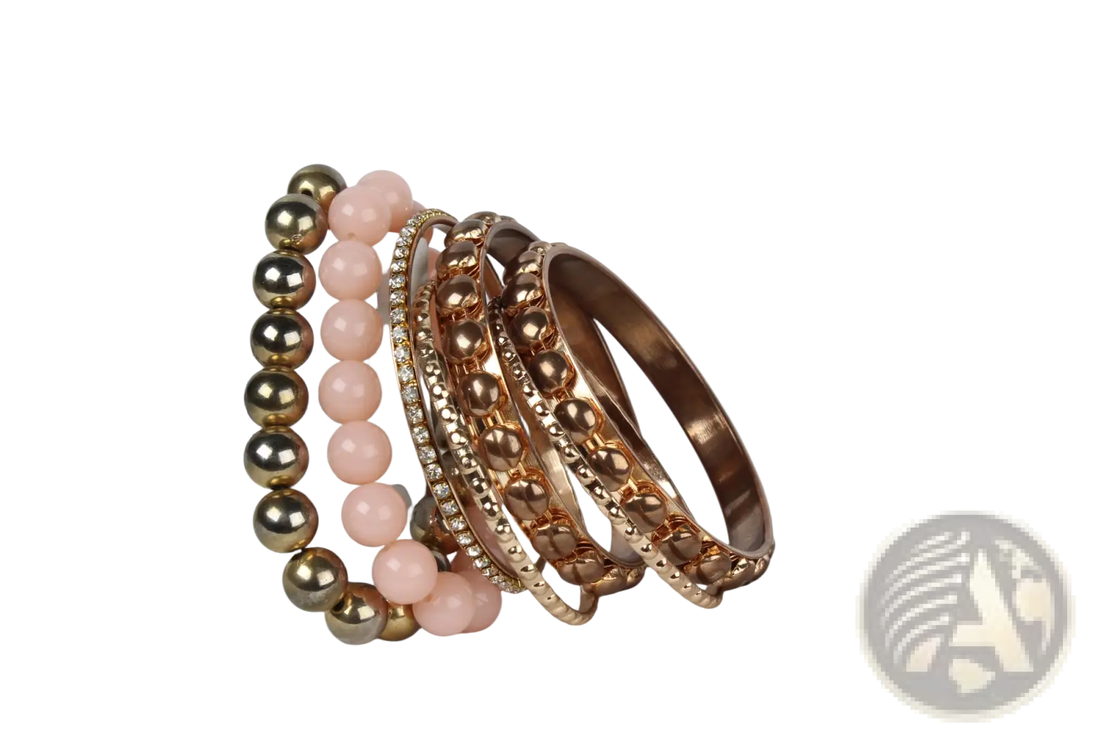A retro gold and pink rhinestone bangle bracelet set featuring rose gold and pink beaded smooth and textured designs