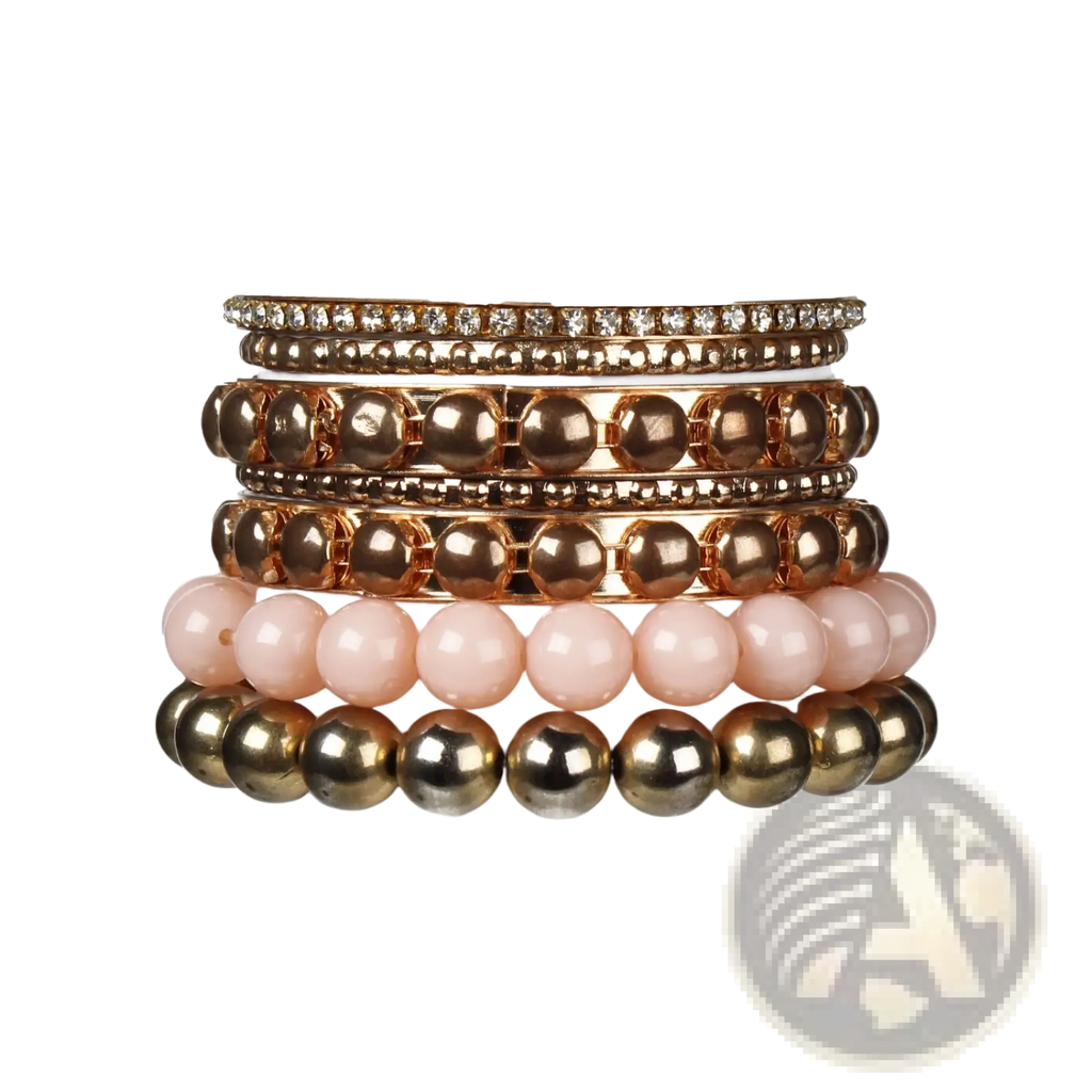 Stack of retro gold and pink rhinestone bangle bracelets featuring rose gold and pink beads with crystal accents