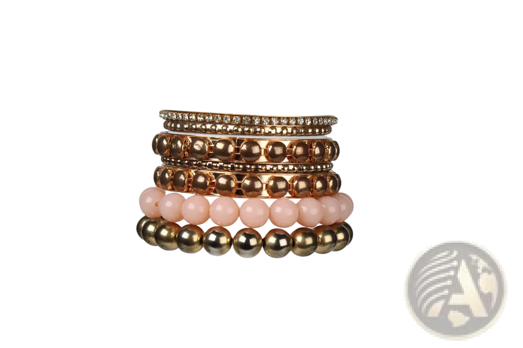 Stack of five retro gold and pink beaded bangle bracelets with rhinestone-encrusted top band in a set