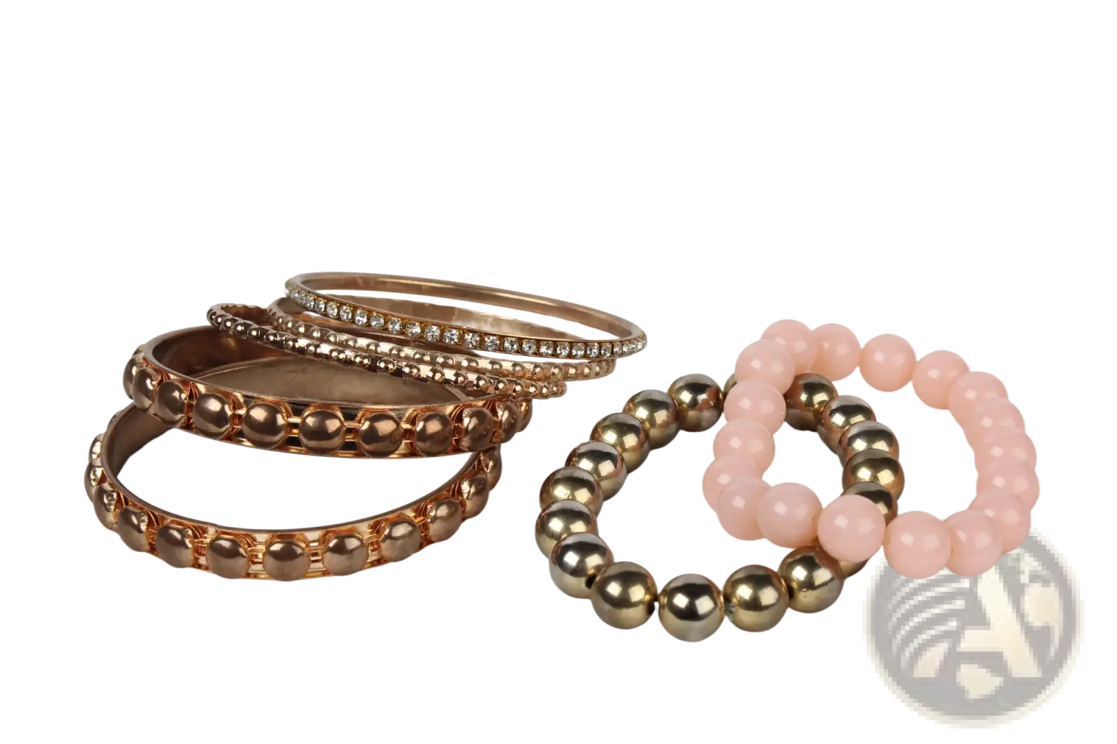 A set of rose gold-toned rhinestone and beaded bangles with a pink and metallic bead bracelet in retro style
