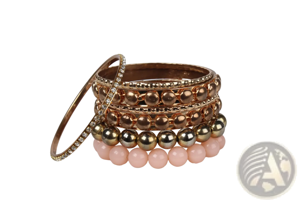 Stack of retro gold and pink rhinestone bangle bracelets featuring rose gold and pink beads with crystal accents