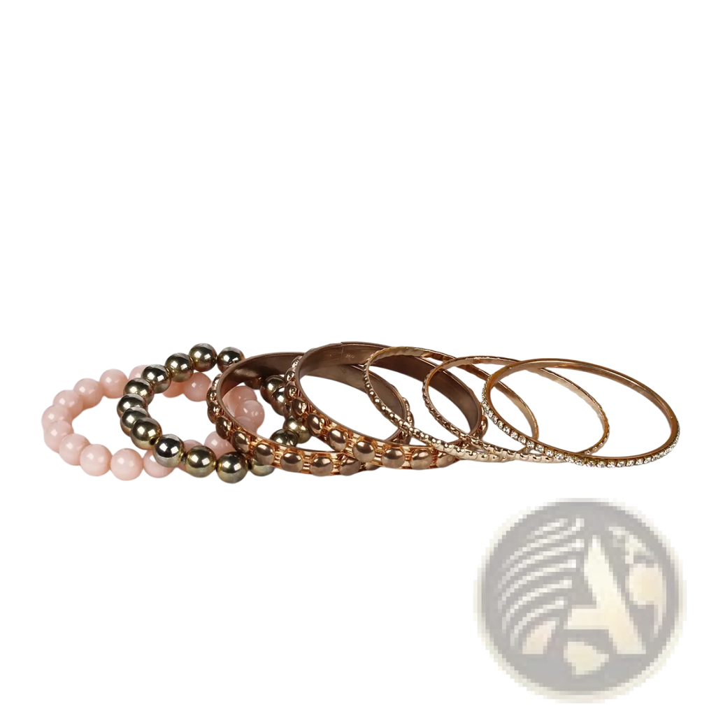 A set of retro gold and pink rhinestone bangle bracelets featuring rose gold and pink beads with metallic accents