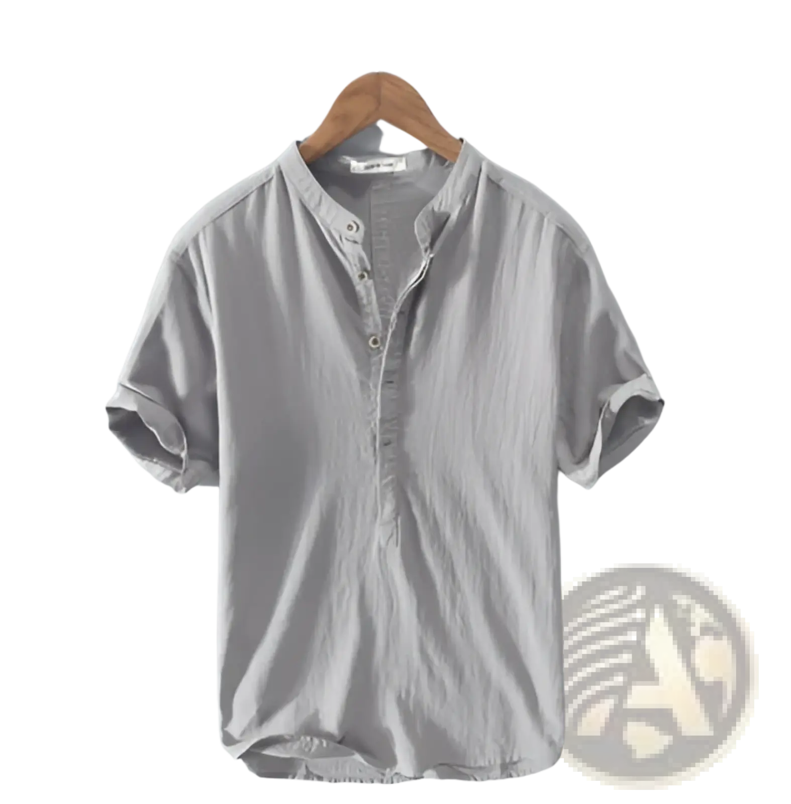 Light gray short-sleeved linen henley shirt with buttoned placket and rolled cuffs hanging on wooden hanger