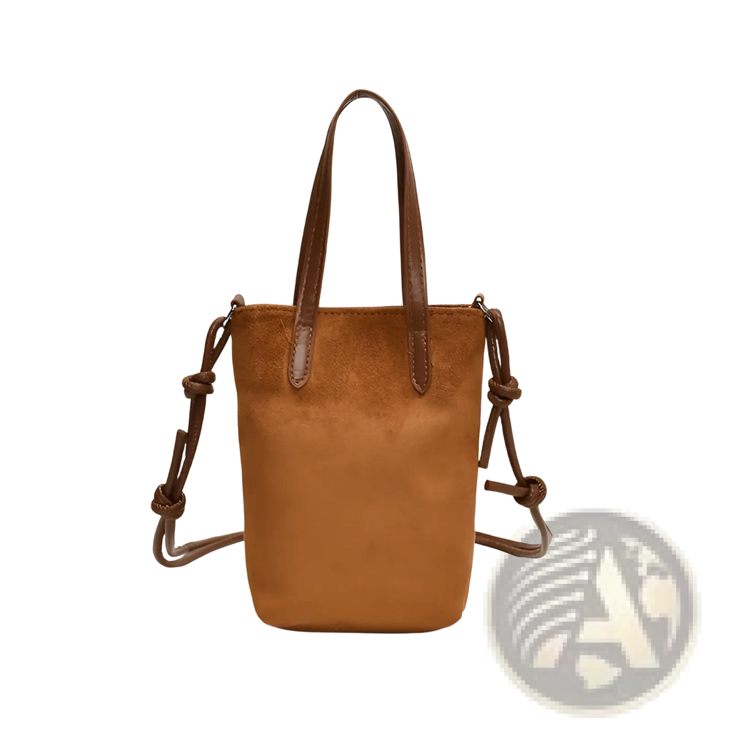 Retro leopard print suede mini bucket crossbody bag in tan suede with brown leather handles and knotted shoulder strap