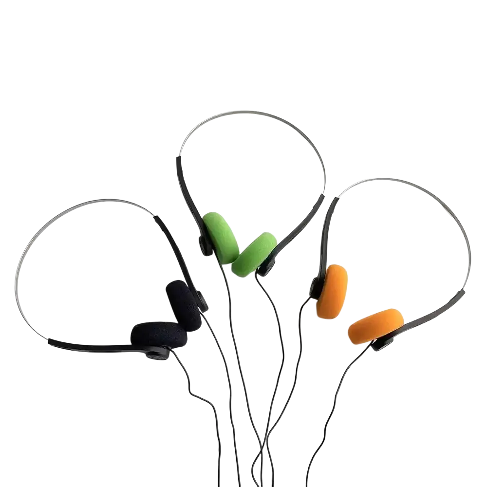 Three pairs of small headphones with retro wired design and colorful foam ear cushions in green orange and black