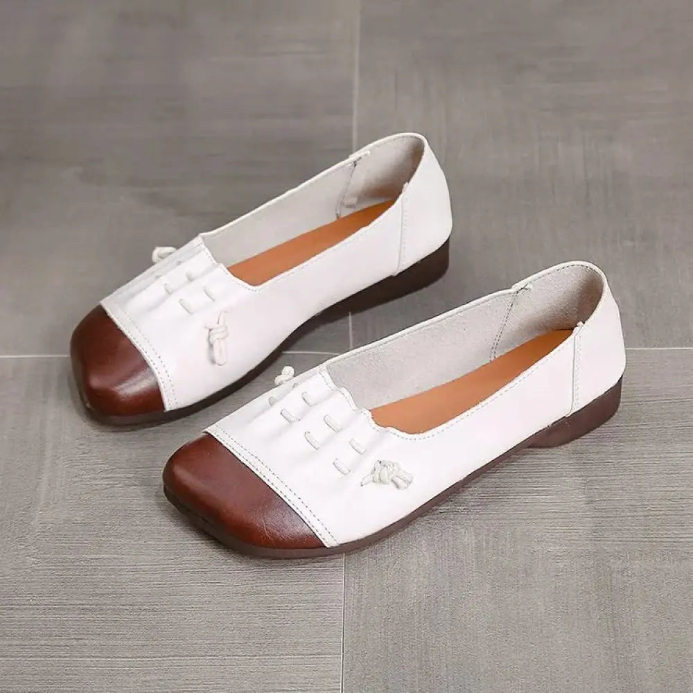 Retro soft sole leather tassel loafers in white and brown with decorative lace-up details on soft leather flat shoes