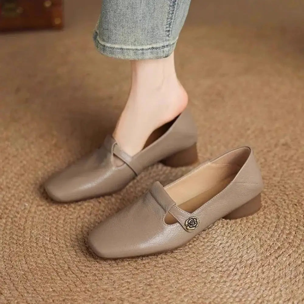 Beige leather retro square toe loafers with low block heel and decorative rose-shaped metal buckle strap