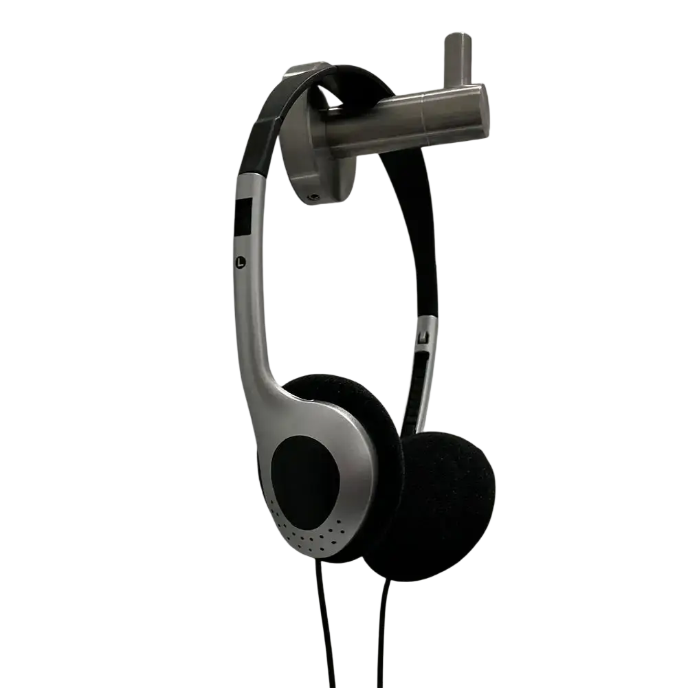 Retro wired over-ear headphones black with silver and black minimalist design hanging on metallic wall mount