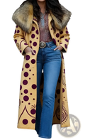 Retro women’s printed long coat in yellow with purple polka dots and a fur-lined hood shown from the back