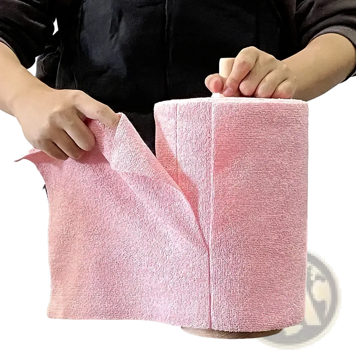Pink reusable microfiber kitchen towel roll made of soft microfiber fabric wrapped around a wooden cylinder