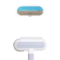 White and blue reusable pet hair remover brush with wide oval head for efficient grooming on furniture and carpets