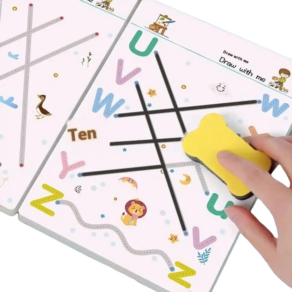 A yellow bone-shaped eraser used on a reusable tracing workbook for kids featuring a children’s tracing mat