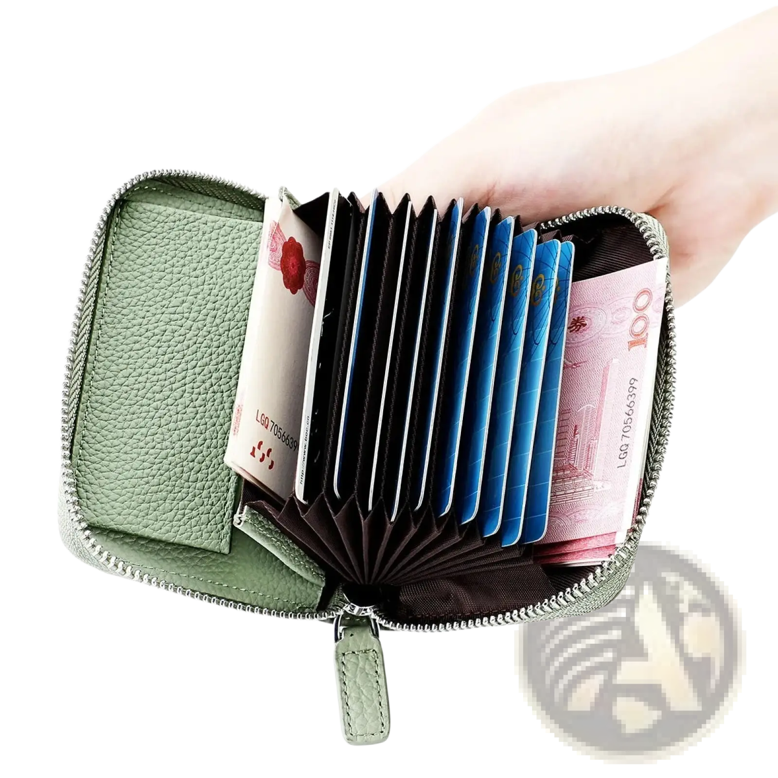 A light green textured leather RFID card wallet with silver zipper open to show card slots and compartments