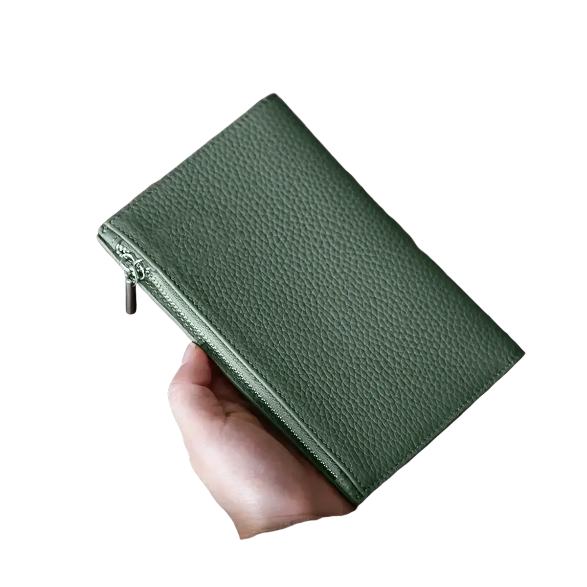 A sleek olive green pebbled leather rfid leather passport holder travel wallet held in a hand with zipper closure