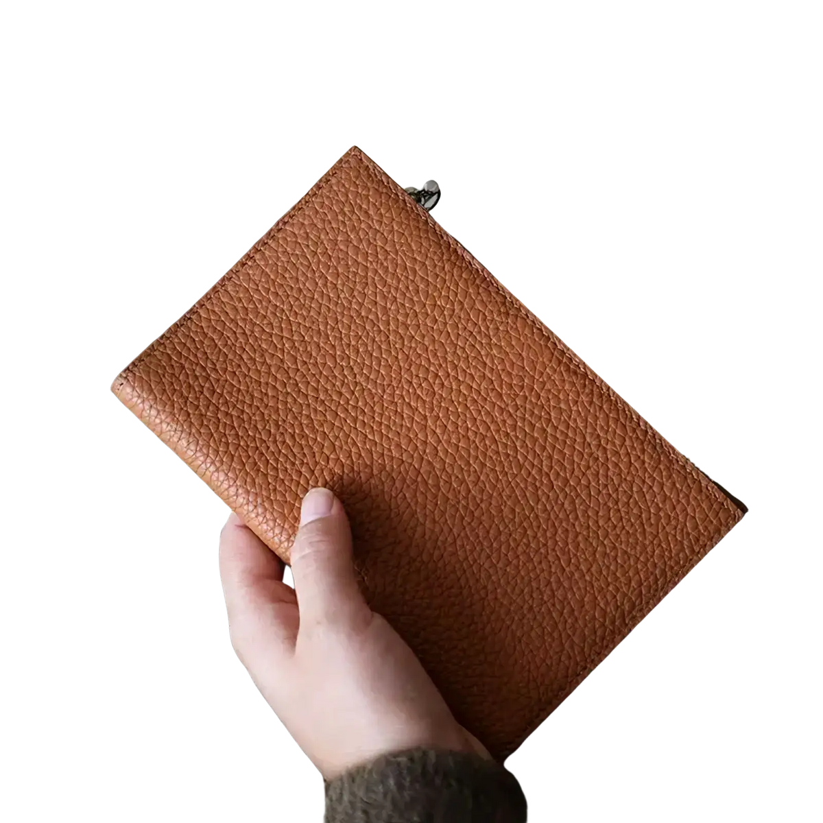A tan pebbled leather rfid passport holder travel wallet with a silver zipper pull for secure travel