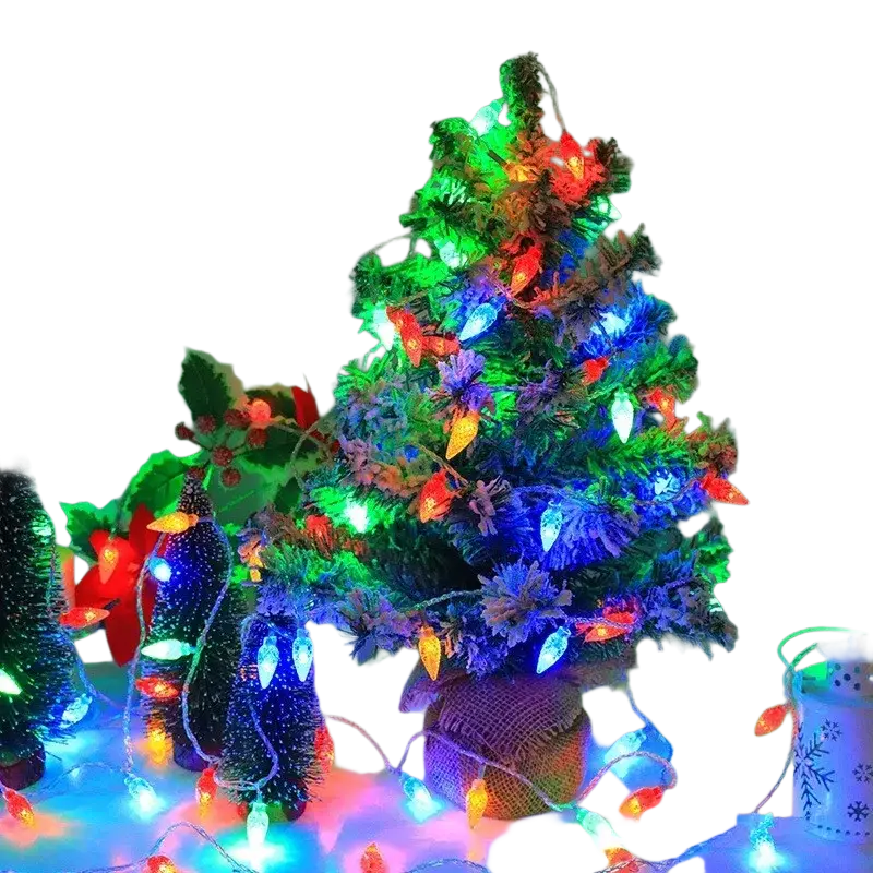 A festive miniature christmas tree with colorful rgb led lights and burlap base for christmas wedding room decor