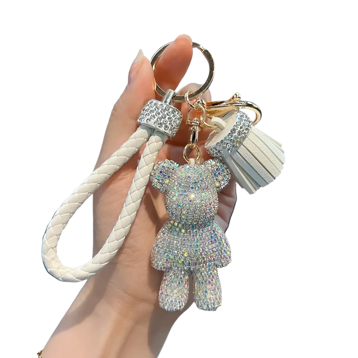 A sparkling white rhinestone bear keychain with braided leather strap and tassel accent
