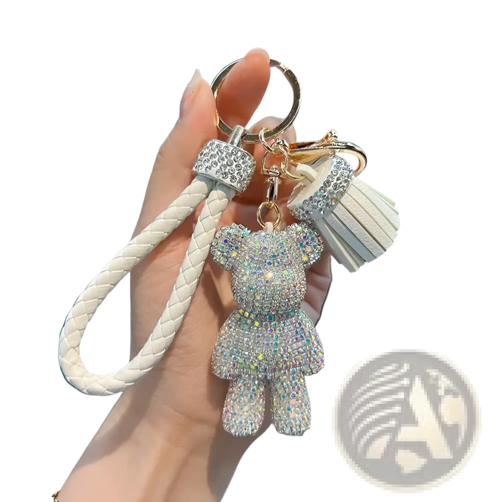 A sparkling white rhinestone bear keychain with braided leather strap and tassel accent