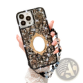 Back side of a black and gold rhinestone bow luxury iPhone case with sparkling crystals ornate mirror and beaded strap