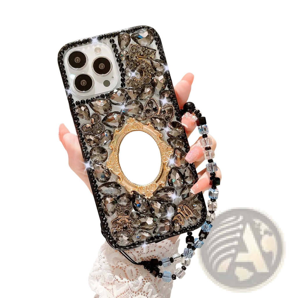 Back view of a black and gold rhinestone bow luxury iPhone case with sparkling crystals, ornate mirror, and beaded strap