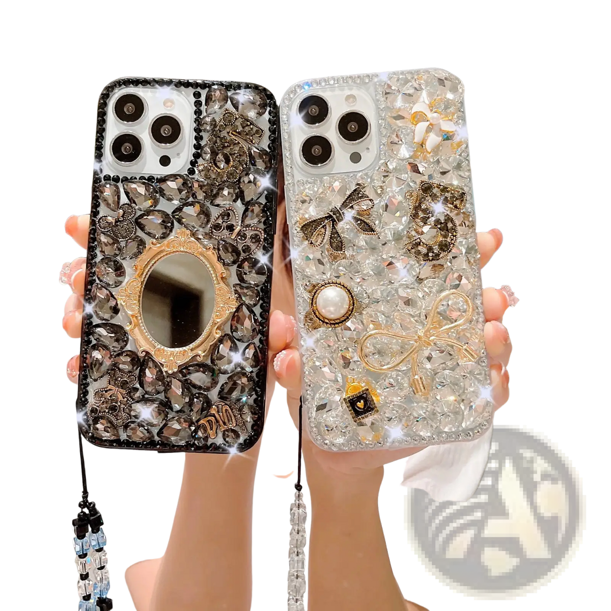Two ornate rhinestone bow luxury iPhone cases in black and clear with pearls and gold-toned decorative mirrors viewed from back