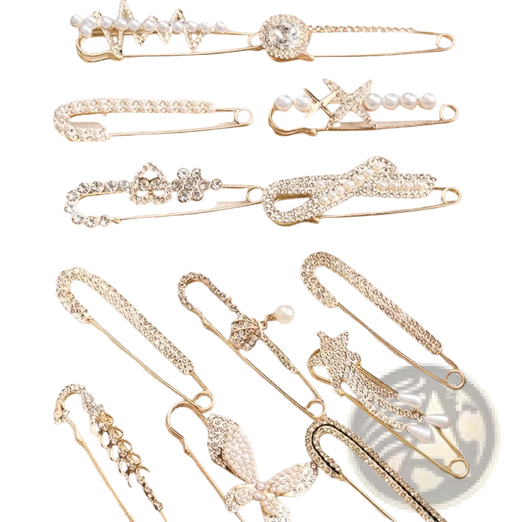 A set of gold-toned rhinestone brooch pins for women featuring crystals pearls and floral and bow designs for scarves