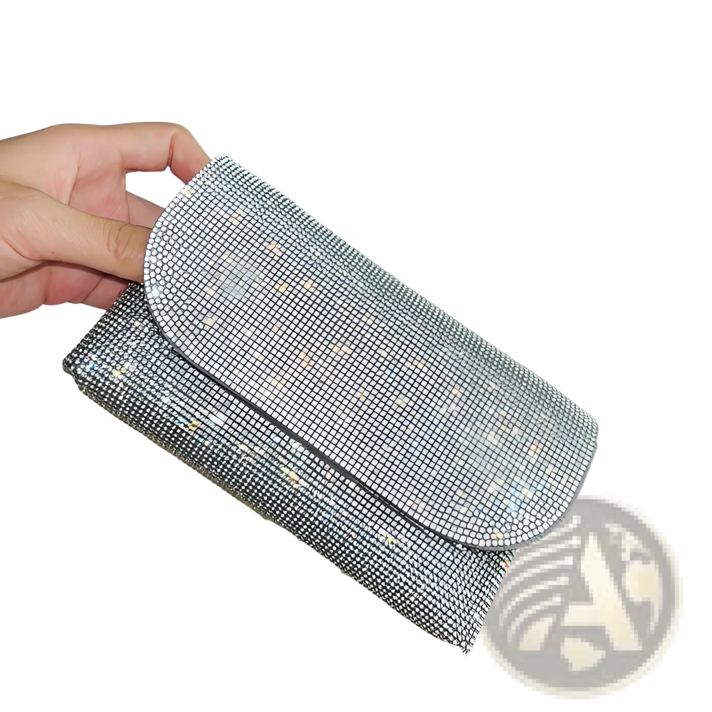 Rhinestone clutch bag with silver chain strap featuring a shimmering silver surface densely covered in rhinestones