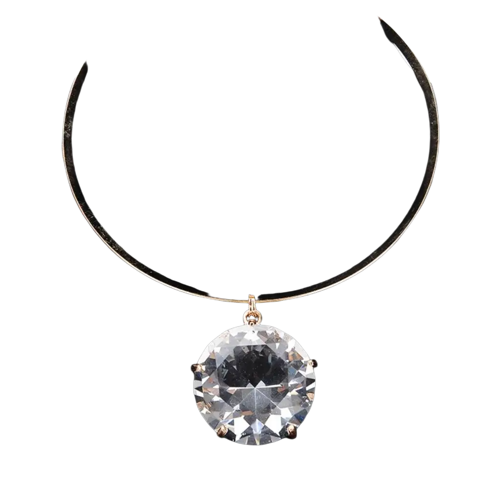 A rhinestone crystal pendant with a sparkling clear crystal hangs from a sleek gold-toned choker necklace