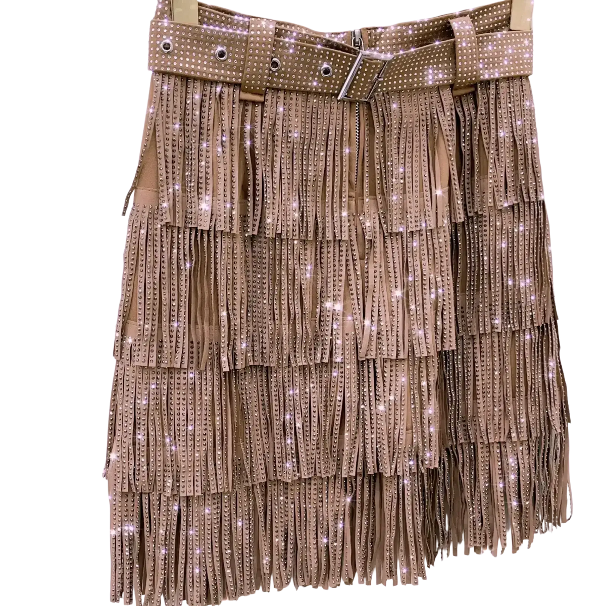 A tan high waist mini skirt with fringe and sparkling rhinestones, featuring a matching studded belt