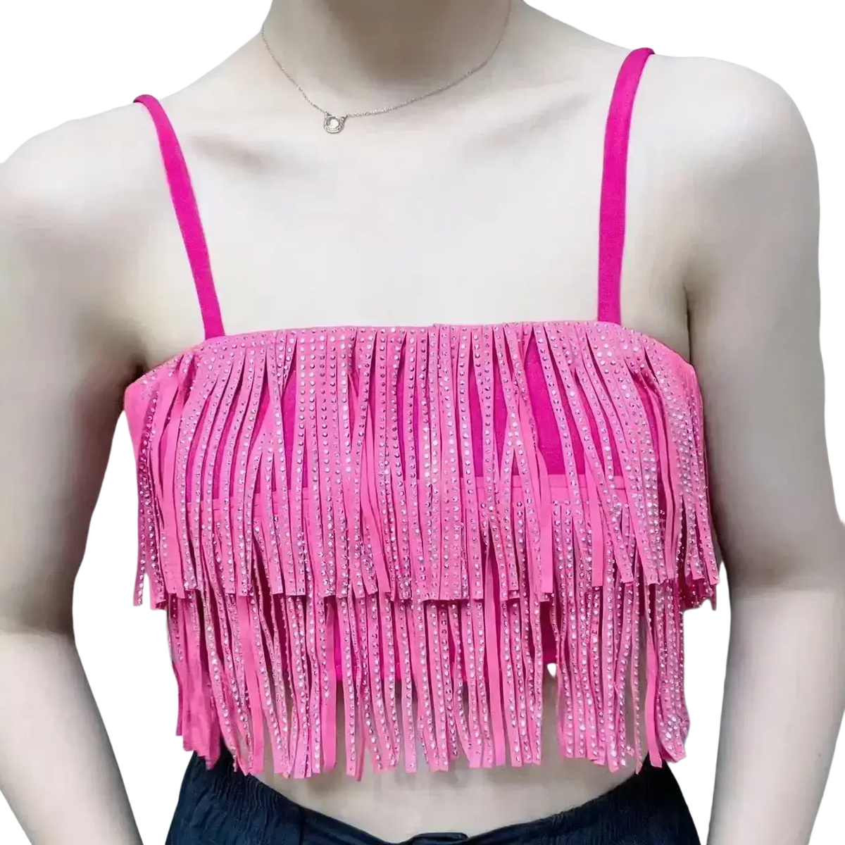 A vibrant pink fringe crop top with thin straps and rhinestone embellishments paired with a high waist mini skirt