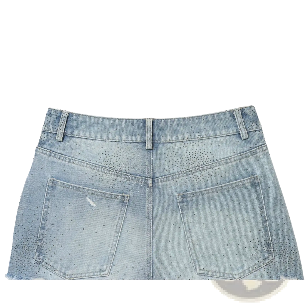 Light-wash denim skirt with distressed perforated design and frayed hem styled as rhinestone high waist denim shorts