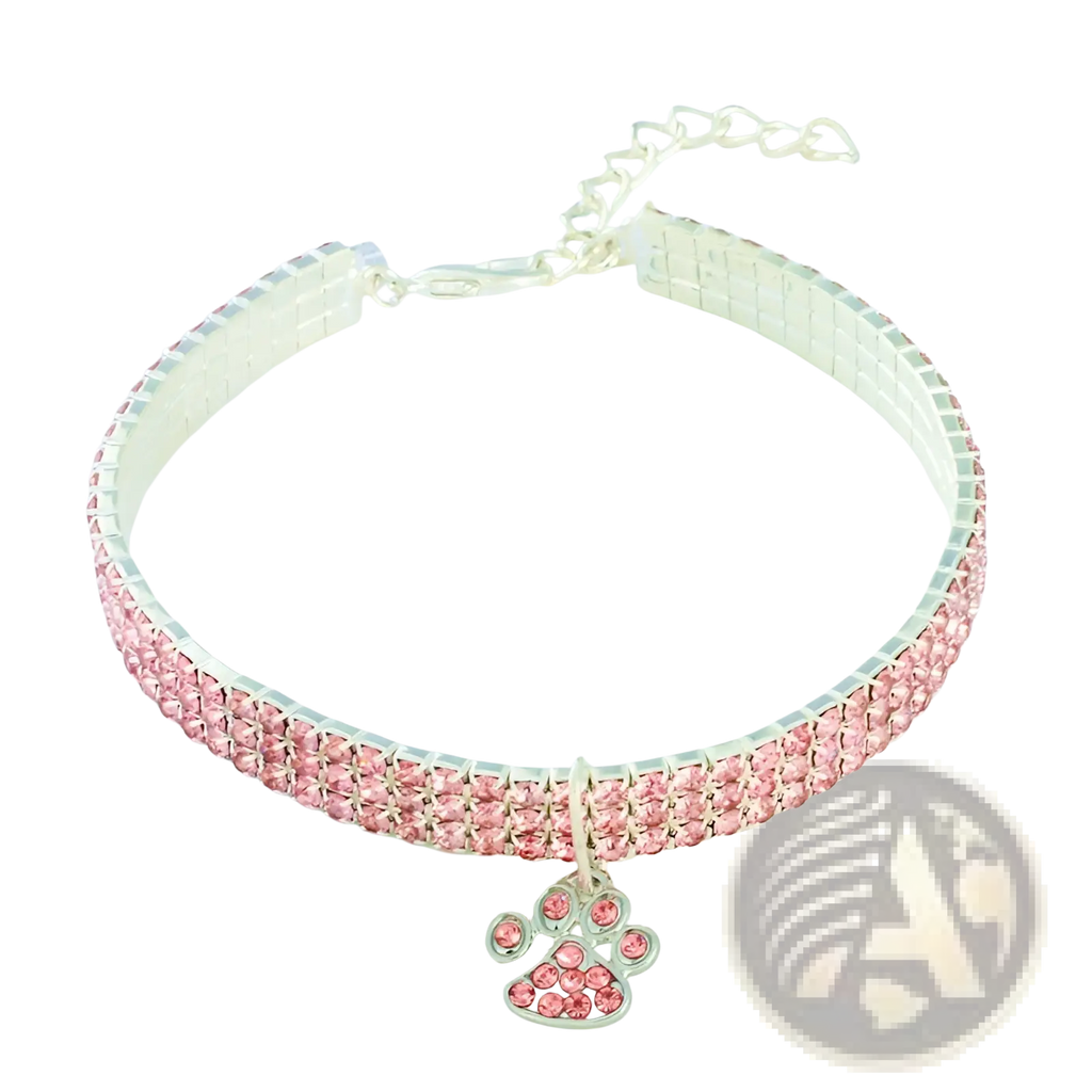 A pink rhinestone pet collar with a silver paw print charm designed for stylish dog identification