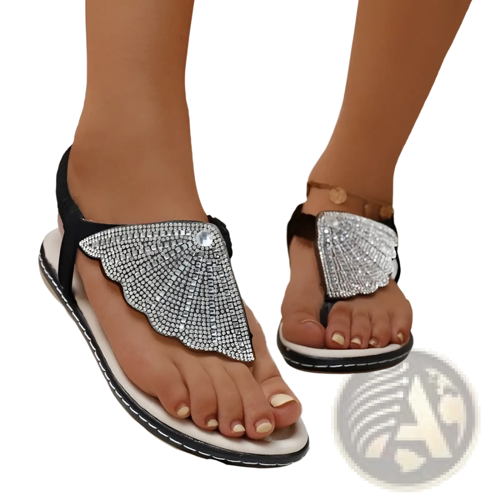Rhinestone shell flip flops for women featuring black and silver rhinestone butterfly wing design with white sole