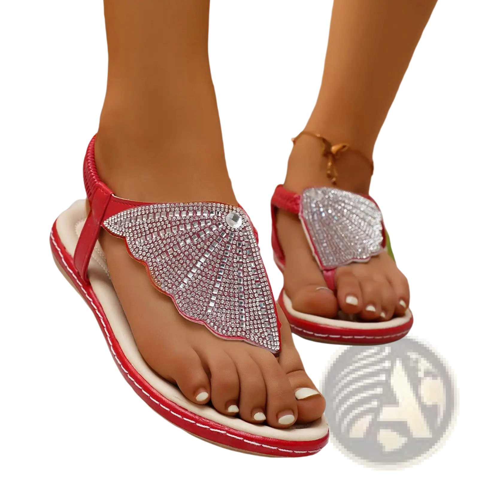 Red thong sandals with a sparkling silver rhinestone wing design on the foot strap for summer beach wear