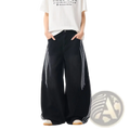 Black rhinestone starburst wide leg jeans featuring white striped side panels in a wide leg style