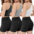Three ribbed crop tank tops in black gray and white with thin straps paired with high-waisted black shorts with pockets