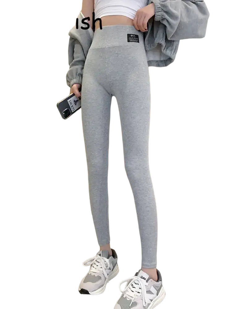 Gray heathered ribbed high waist workout leggings with subtle branding patch designed for fitness activities