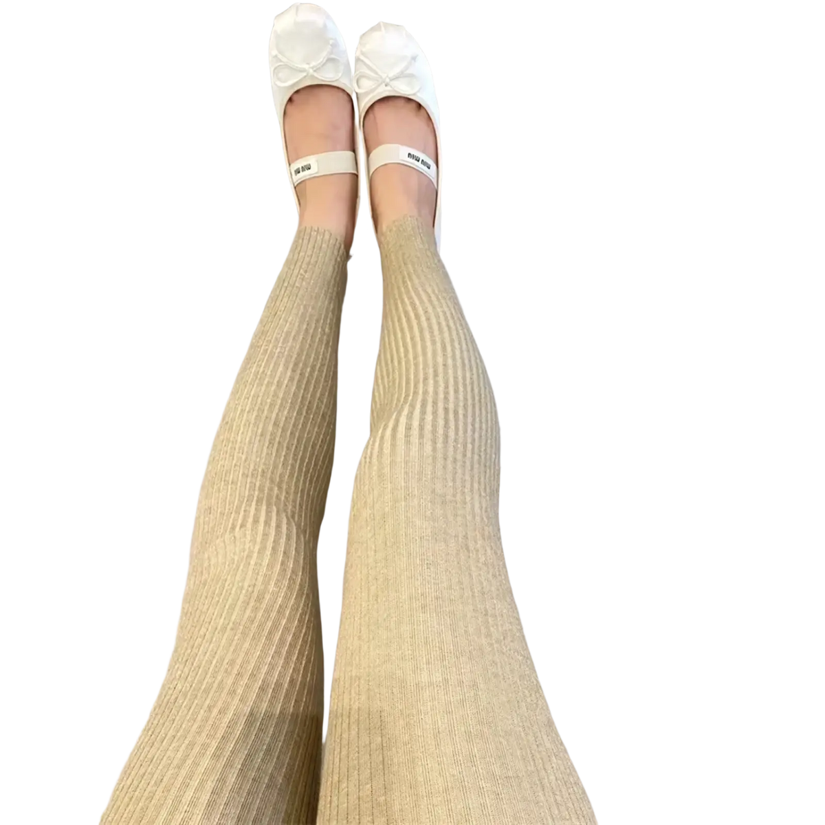 Cream-colored ribbed knit high waist leggings paired with white miu miu ballet flats for winter wear