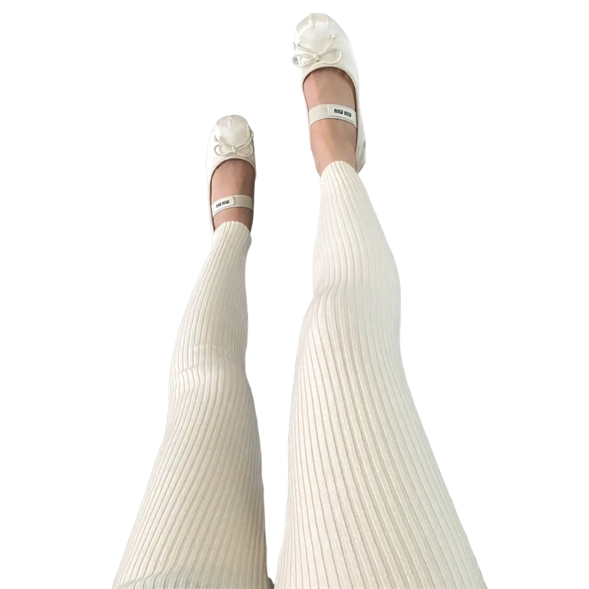 Cream-colored ribbed knit high waist winter leggings paired with white miu miu ballet flats with bow details