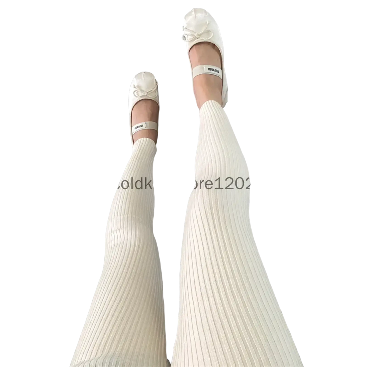 Cream-colored ribbed knit leggings high waist winter pants paired with white miu miu ballet flats featuring bow details