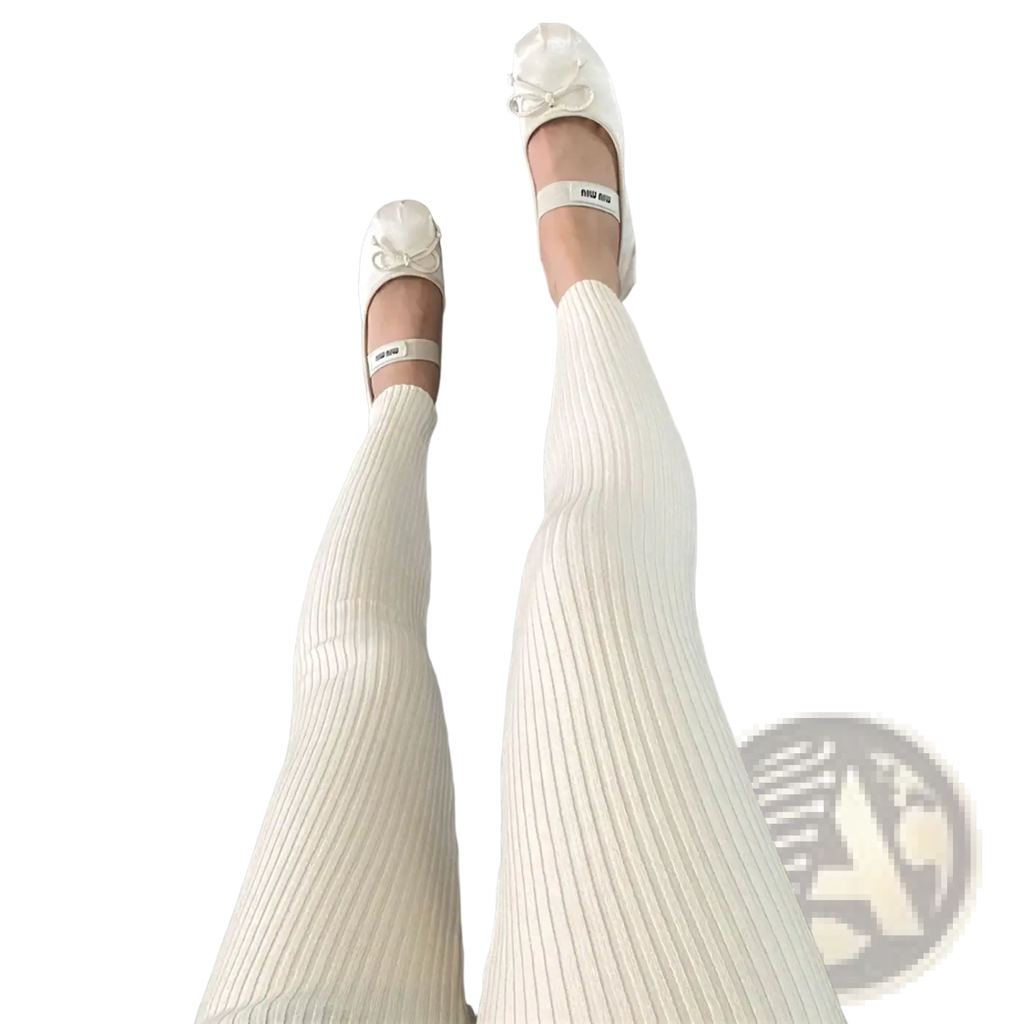 Cream-colored ribbed knit high waist winter leggings paired with white miu miu ballet flats with bow details